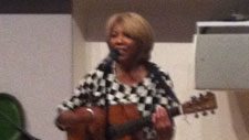 Linda Lewis playing guitar at the V & A